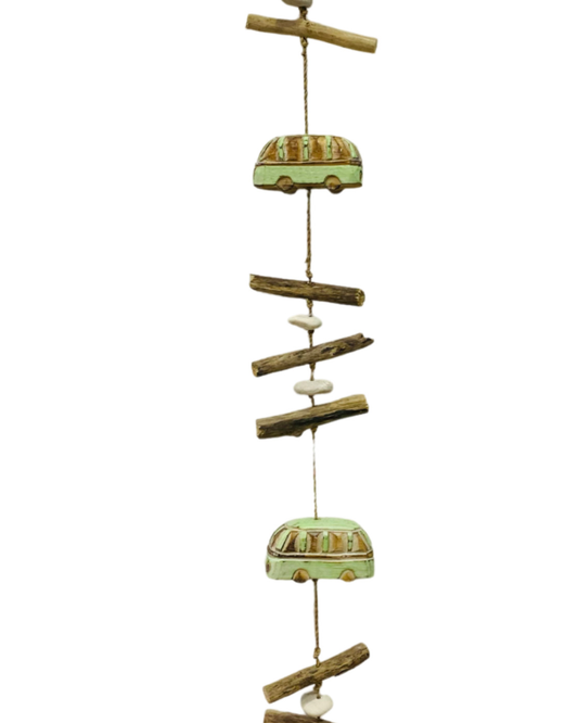 A hanger with three wooden carved combis, pebbles and driftwood pieces. Available with either white, green or navy combis. 