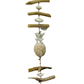 A hanger with three wooden pineapples, white pebbles and driftwood pieces. Pineapples are available in white, green or navy.