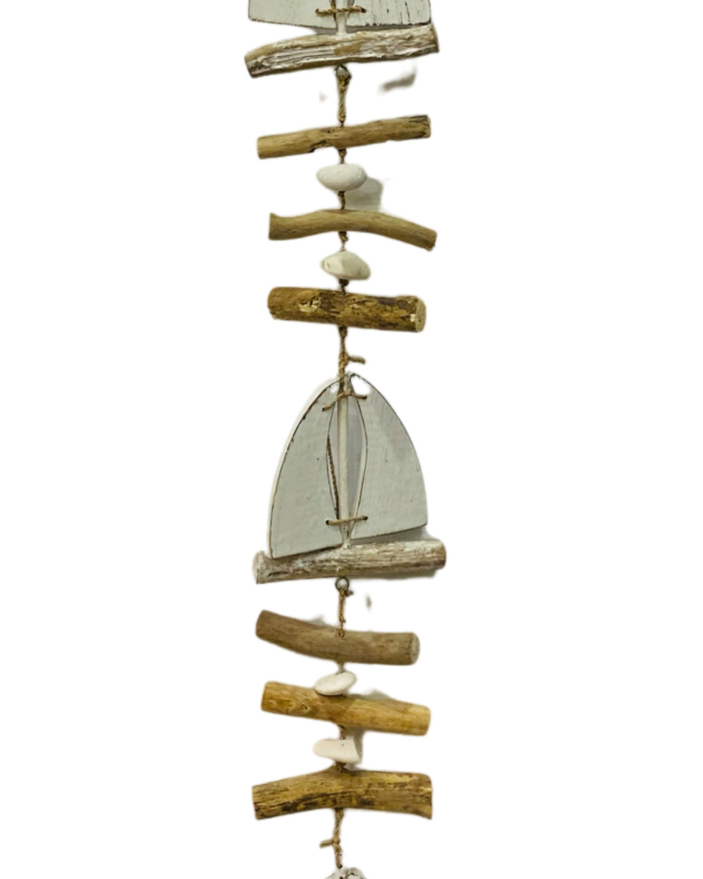 A driftwood boat hanger with three wooden white boats, pebbles and driftwood pieces.
