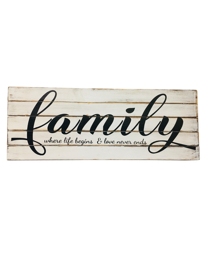 A large wooden sign that says - Family, where life begins & love never ends. Available in white with black writing or brown with white writing. 