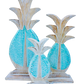 Wooden carved standing pineapples available in different colours and sizes. 
